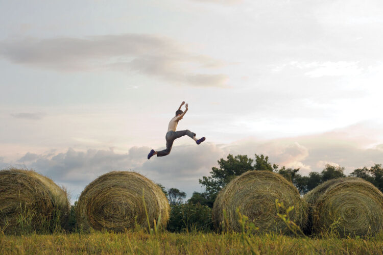 Photos from the Field: Country Boy Jumps Between Hay Bales